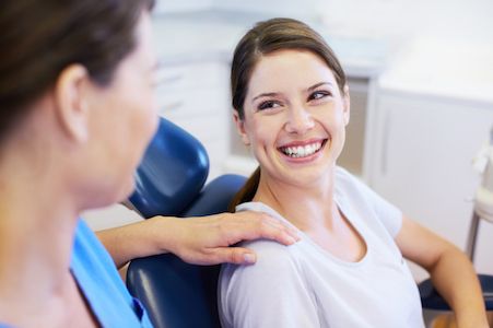 dentist talking to patient about dental crowns