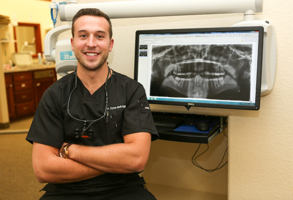 Dr. Dylan McKnight reviewing a dental x-ray