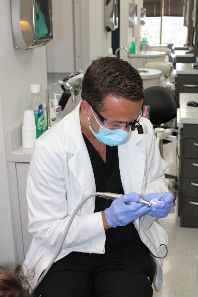 Dr. McKnight providing restorative dental care to a patient